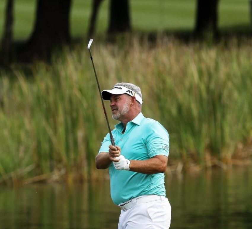 Darren Clarke of Northern Ireland watches his shot during the first day of the Maybank Championship golf tournament in Kuala Lumpur, Malaysia.
